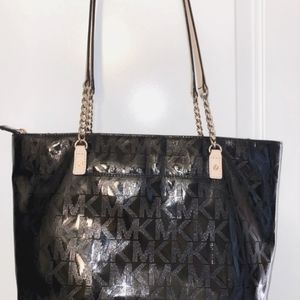 Michael kors patent leather handbag.